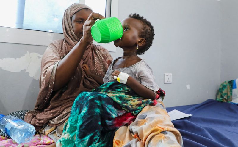 An internally displaced Somali woman feeds her malnourished child at the Daynile hospital as shortages of lifesaving therapeutic foods caused by shipping disruptions due to the Iran war have forced clinics treating severely malnourished children to turn away patients and ration supplies in drought-hit Somalia, in Daynile district of Mogadishu, Somalia April 20, 2026. REUTERS/Feisal Omar