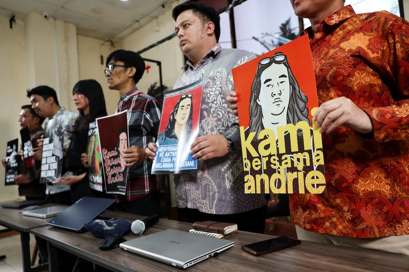 Advocacy for Democracy Team (TAUD) members hold posters in solidarity with Andrie Yunus, an activist and deputy coordinator with Indonesia's rights group Commission for Missing Persons and Victims of Violence (KontraS), who suffered burns to 24% of his face and arms from acid thrown by two unidentified assailants on a motorcycle on March 12, after a press conference in Jakarta, Indonesia, March 16, 2026. REUTERS/Willy Kurniawan