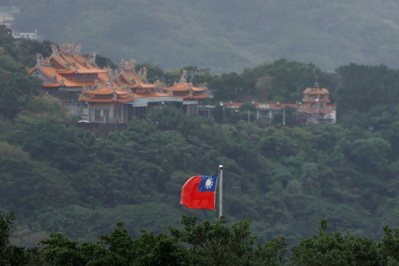 FILE PHOTO: A Taiwan flag flutters in Keelung, as China conducts "Justice Mission 2025" military drills around Taiwan, in Keelung, Taiwan, December 30, 2025. REUTERS/Ann Wang/ File Photo