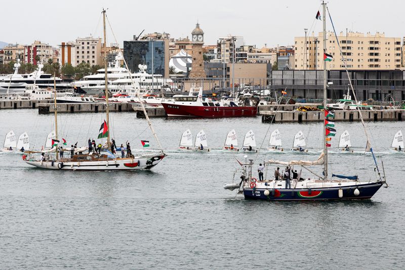 Boats taking part in a humanitarian flotilla depart for Gaza from Barcelona, Spain, April 12, 2026. REUTERS/Nacho Doce