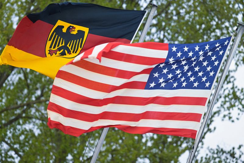 The German flag featuring the Federal Eagle and the U.S. flag are pictured at the German Navy base in Kiel, Germany, April 23, 2026. REUTERS/Fabian Bimmer