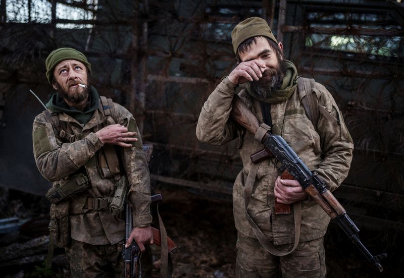 Andrii and Vasyl, servicemen of the 93rd Kholodnyi Yar Separate Mechanized Brigade of the Ukrainian Armed Forces react after returning from a frontline position after manning it for about half a year, amid Russia's attack on Ukraine, in Donetsk region, Ukraine April 29, 2026. REUTERS/Serhii Korovainyi