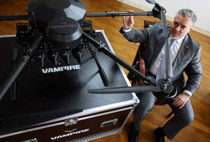 Ukraine's Ambassador to Japan Yurii Lutovinov poses for a photograph next to a mockup of Ukrainian-made Vampire drone during an interview with Reuters at Ukraine Embassy in Tokyo, Japan April 28, 2026.  REUTERS/Issei Kato