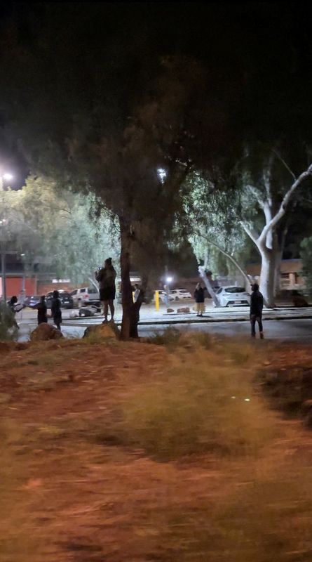 Protesters gather in the streets of Alice Springs, Australia, April 30, 2026, following the arrest of 47-year-old Jefferson Lewis in connection with the murder of a missing five-year-old Indigenous girl, according to the Australian police, in this screengrab from video obtained from social media. Li Chuan, Chiu/via REUTERS