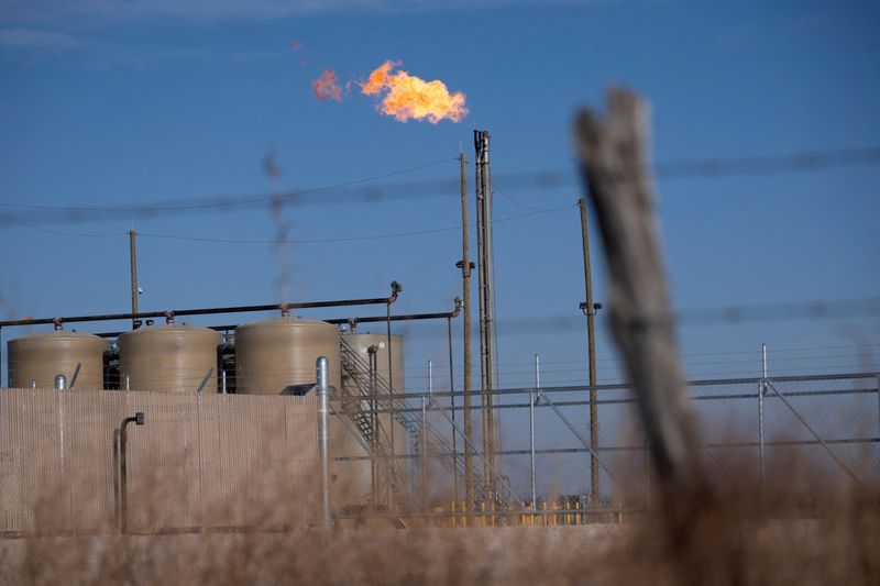 FILE PHOTO: A flare burns off excess natural gas in the Permian Basin oil field near Odessa, Texas, U.S. February 18, 2025.  REUTERS/Eli Hartman/File Photo