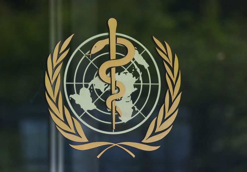 Logo of the World Health Organisation (WHO) on a glass panel at the WHO headquarters in Geneva, Switzerland, April 29, 2026. REUTERS/Denis Balibouse