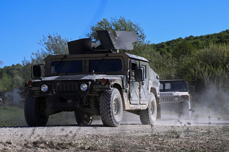 Military vehicles drive during the U.S. Army Combined Resolve exercise at the U.S. Army's southern Germany training facilities in Hohenfels, Germany, April 30, 2026. REUTERS/Angelika Warmuth