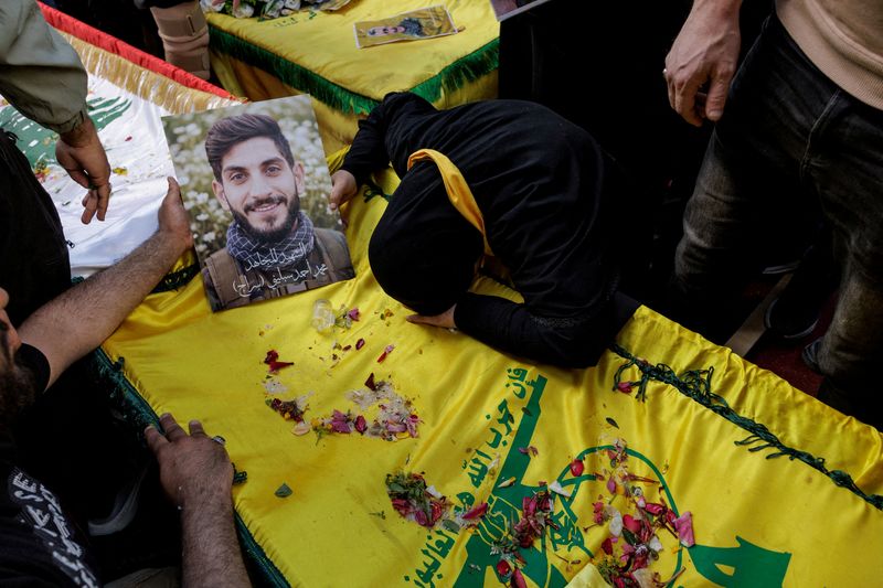 FILE PHOTO: Aida Abou Khalil mourns her son, Mohamed Ahmed Seblini, a Hezbollah fighter killed during the conflict with Israel, during his funeral, amid a 10-day ceasefire between Lebanon and Israel, in Qlaileh, Southern Lebanon, April 21, 2026. REUTERS/Zohra Bensemra/File Photo