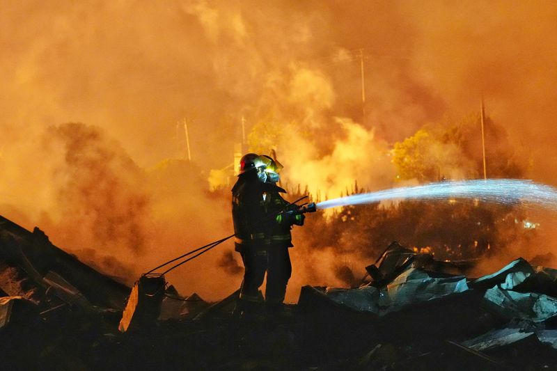 Firefighters work to extinguish a fire following a blast at a fireworks manufacturing factory in Liuyang, Hunan province, China, May 5, 2026. cnsphoto via REUTERS