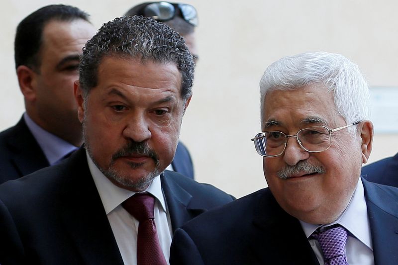 Palestinian President Mahmoud Abbas, accompanied by his son Yasser, leaves a hospital in Ramallah in the Israeli-occupied West Bank, May 28, 2018. REUTERS/Mohamad Torokman/File Photo