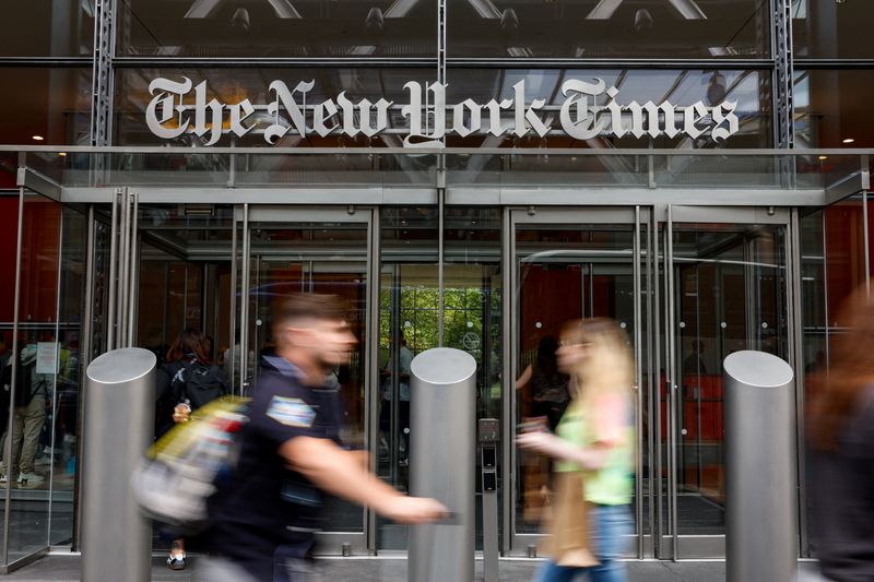People walk by The New York Times building in Manhattan, New York City, U.S., September 16, 2025. REUTERS/Kylie Cooper