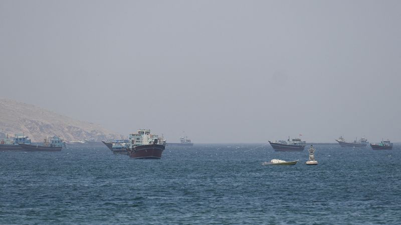 FILE PHOTO: Ships and boats in the Strait of Hormuz, Musandam, Oman, May 4, 2026. REUTERS/Stringer/File Photo