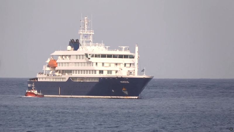A boat beside cruise ship MV Hondius anchored off Cape Verde port, on the day sick passengers were evacuated by boat from the cruise ship, in Praia Port, Cape Verde, in this screengrab obtained from a video, May 5, 2026. REUTERS TV via REUTERS