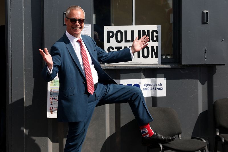 Britain's Reform UK leader Nigel Farage poses outside a polling station after voting during local elections in Walton-on-the-Naze, Britain, May 7, 2026. REUTERS/Toby Melville