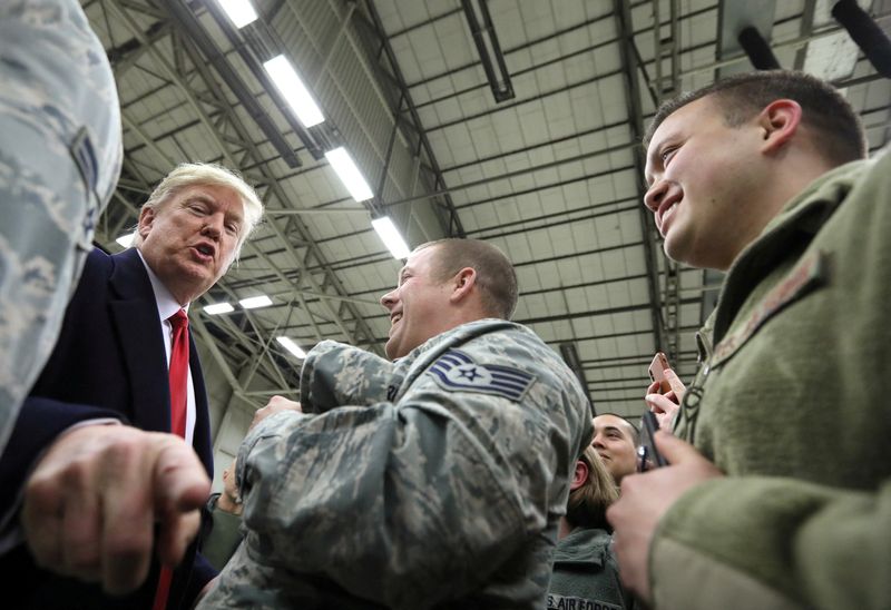 FILE PHOTO: U.S. President Donald Trump gestures as he visits U.S. troops at Ramstein Air Force Base, Germany, December 27, 2018. REUTERS/Jonathan Ernst/File Photo