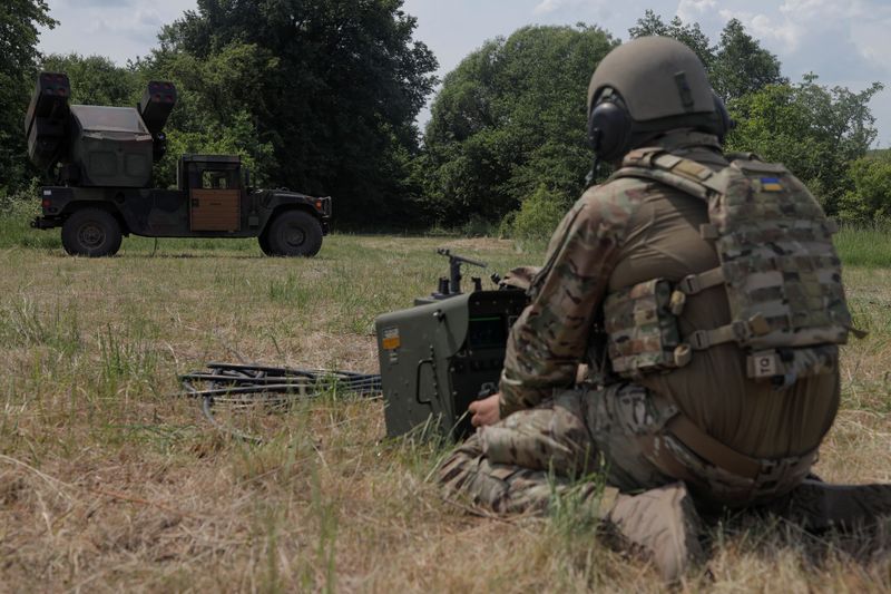 A Ukrainian serviceman prepares a remote controller for an AN/TWQ-1 Avenger mobile air defence missile system during his combat shift, amid Russia's attack on Ukraine, outside of Kyiv, Ukraine June 16, 2023. REUTERS/Anna Voitenko/File Photo