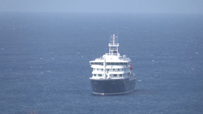 Cruise ship MV Hondius docks off Cape Verde port, as passengers were not allowed off the ship, while health authorities investigated suspected cases of hantavirus aboard the vessel, in Praia Port, Cape Verde, in this screengrab obtained from a video, May 4, 2026. REUTERS TV via REUTERS
