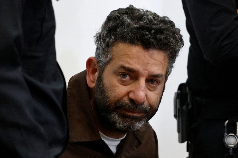 FILE PHOTO: Activist Saif Abu Keshek, a Spanish national, who was detained aboard the Gaza-bound Global Sumud Flotilla, which was intercepted by Israeli forces in international waters, appears at a court in Beersheba, southern Israel May 6, 2026. REUTERS/Amir Cohen/File Photo