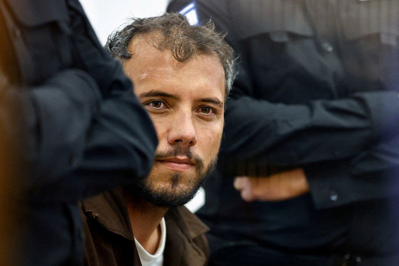 FILE PHOTO: Brazilian Activist Thiago Avila, who was detained aboard the Gaza-bound Global Sumud Flotilla, which was intercepted by Israeli forces in international waters, appears at a court in Beersheba, southern Israel May 6, 2026. REUTERS/Amir Cohen/File Photo