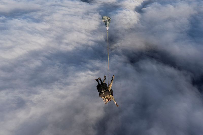 An ICU Nurse and a paratrooper jump from 16 Air Assault Brigade to provide medical support to people , after the UK Health Security Agency (UKHSA) on Friday confirmed one suspected case of Hantavirus of a British national on Tristan da Cunha, Britain, May 9, 2026. AS1 Georgia Callaway/UK MOD Crown/Handout via REUTERS