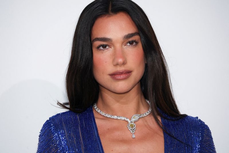 FILE PHOTO: Dua Lipa arrives for the Elton John AIDS Foundation Academy Awards Viewing Party, in West Hollywood, California, U.S., March 15, 2026. REUTERS/Aude Guerrucci/File Photo
