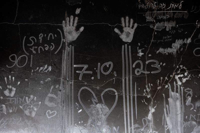 Hand prints and other markings made in the soot on a wall are seen, nearly a year since the deadly October 7 attack by Hamas, in Kibbutz Beeri, southern Israel, September 15, 2024. REUTERS/Amir Cohen