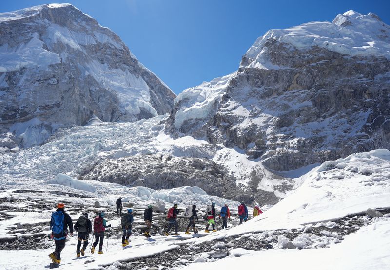 Members of an expedition team hike at Khumbu Icefall, as the route to Mount Everest Camp One has not yet been opened for the season in Solukhumbu district, also known as the Everest region, Nepal, April 22, 2026. REUTERS/Purnima Shrestha