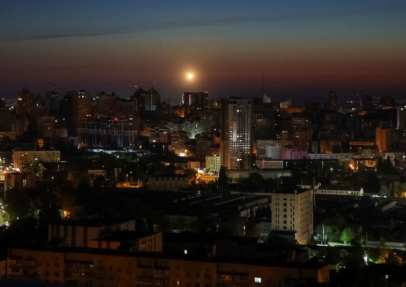 An explosion over the city as Ukrainian servicemen hit a Russian drone during a Russian drone strike, amid Russia's attack on Ukraine, in Kyiv, Ukraine May 12, 2026. REUTERS/Gleb Garanich