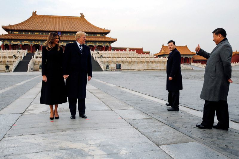 FILE PHOTO: U.S. President Donald Trump and U.S. first lady Melania visit the Forbidden City with China's President Xi Jinping in Beijing, China, November 8, 2017. REUTERS/Jonathan Ernst/File Photo