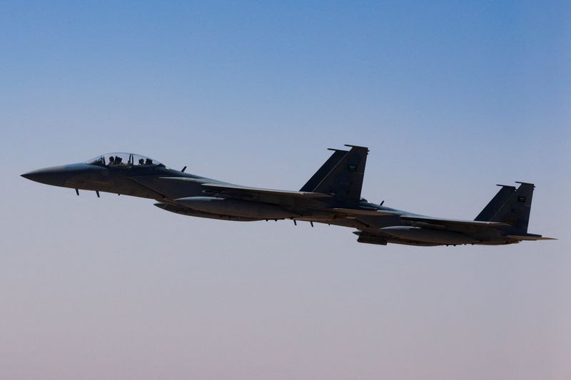 FILE PHOTO: A Saudi fighter jet accompanies Air Force One, carrying U.S. President Donald Trump, on approach to the King Khalid International Airport in Riyadh, Saudi Arabia, May 13, 2025. REUTERS/Brian Snyder/File Photo