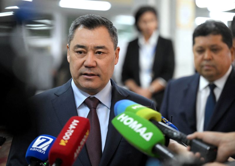 Kyrgyz President Sadyr Japarov speaks to the media as he visits a polling station during the snap parliamentary election in Bishkek, Kyrgyzstan November 30, 2025. Kyrgyz Presidential Press Service/Handout via REUTERS