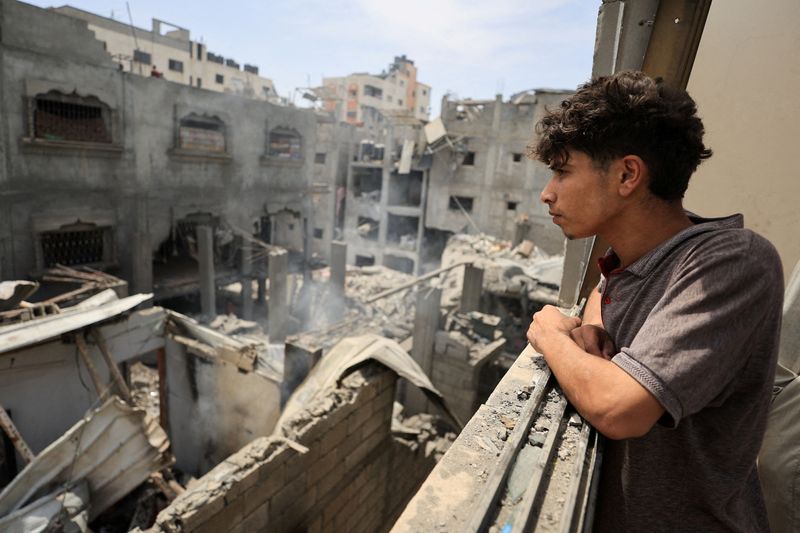 Palestinians inspect the site of a Friday Israeli air strike on houses, at Shati (Beach) refugee camp in Gaza City, May 9, 2026. REUTERS/Dawoud Abu Alkas