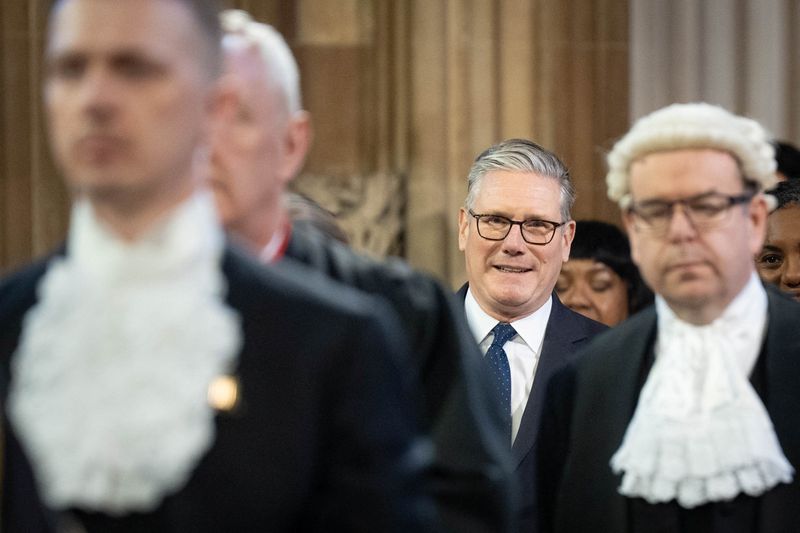 Britain's Prime minister, Keir Starmer walks through the Central Lobby of the Houses of Parliament in London to the House of Lords to hear the King's Speech during the State Opening of Parliament, in London, Britain May 13, 2026.    Stefan Rousseau/Pool via REUTERS
