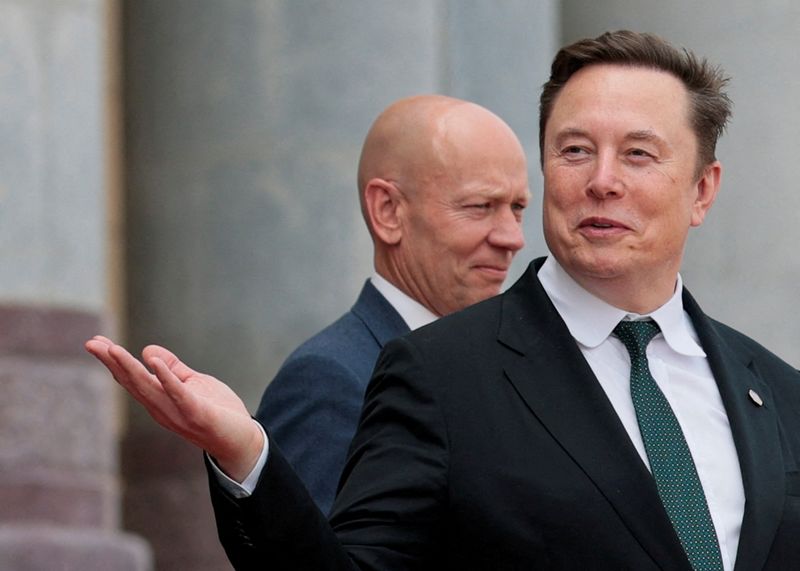 FILE PHOTO: Elon Musk gestures as he leaves after attending a welcome ceremony for U.S. President Donald Trump with Chinese President Xi Jinping at the Great Hall of the People in Beijing, China, May 14, 2026. REUTERS/Evan Vucci/File Photo
