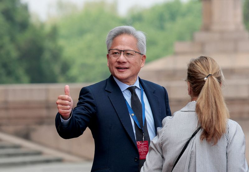 Jensen Huang, Founder, President and CEO of Nvidia gestures as he leaves after attending a welcome ceremony for U.S. President Donald Trump with Chinese President Xi Jinping at the Great Hall of the People in Beijing, China, May 14, 2026. REUTERS/Evan Vucci