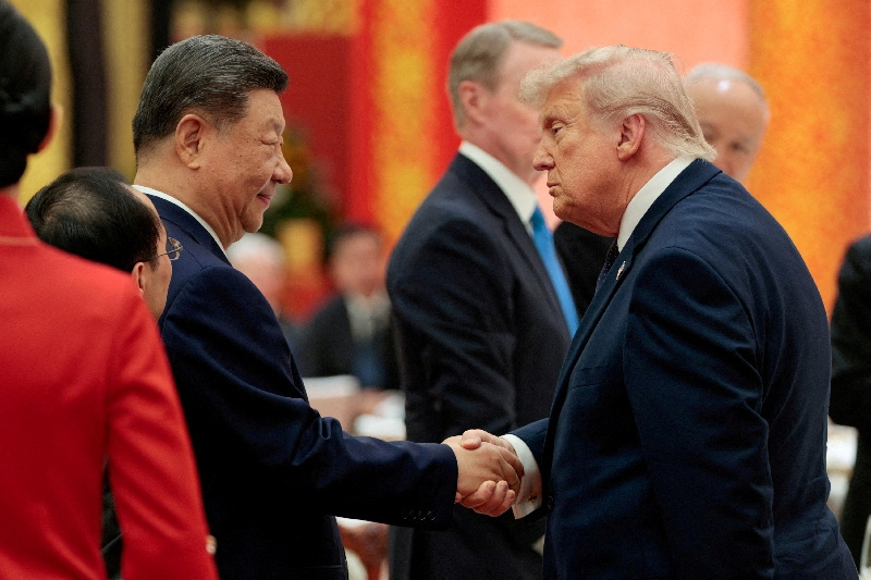 Chinese President Xi Jinping and U.S. President Donald Trump shake hands at a state banquet at the Great Hall of the People in Beijing, China, May 14, 2026. REUTERS/Evan Vucci     TPX IMAGES OF THE DAY