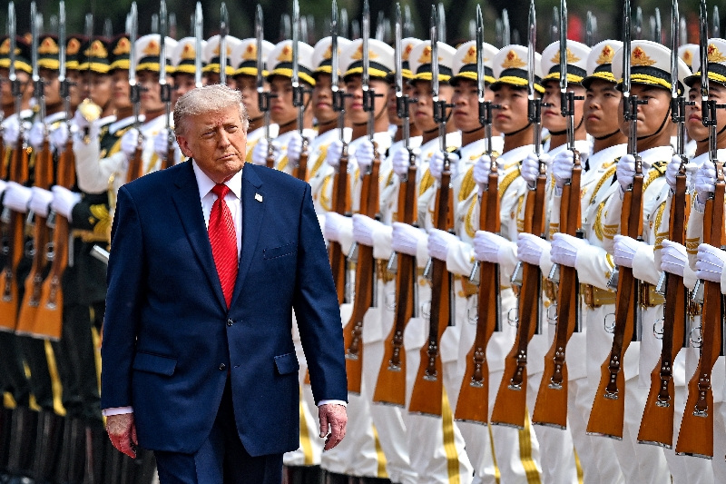 U.S. President Donald Trump reviews the troops, in Beijing, China, May 14, 2026, during a trip focused on trade, regional security, and strengthening bilateral ties between the world’s two largest economies. Kenny Holston/Pool via REUTERS