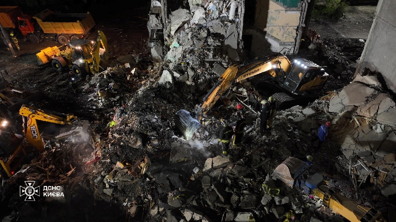 Firefighters work at a site of the apartment building damaged during yesterday's Russian missile and drone strike, amid Russia's attack on Ukraine, in Kyiv, Ukraine in this handout picture released May 15, 2026. Press service of the State Emergency Service of Ukraine in Kyiv/Handout via REUTERS