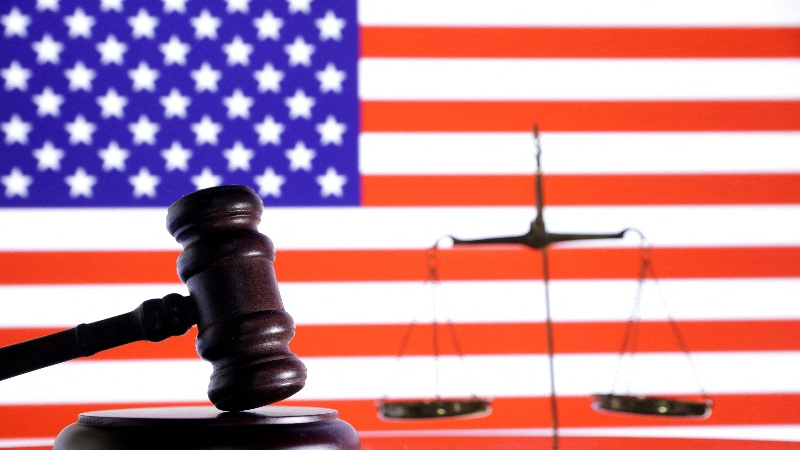 FILE PHOTO: The U.S. flag, a judge gavel and a vintage scale are seen in this illustration taken August 6, 2024. REUTERS/Dado Ruvic/Illustration/File Photo