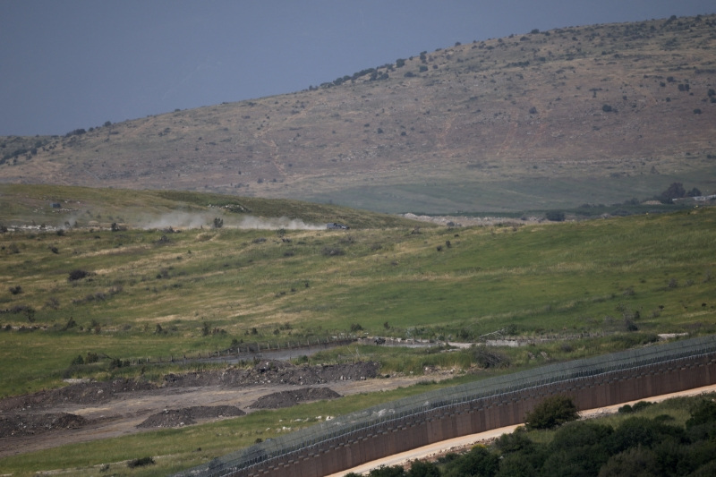 An Israeli military vehicle operates in Lebanon by the Israeli‑Lebanese border, as seen from northern Israel, May 14, 2026. REUTERS/Shir Torem