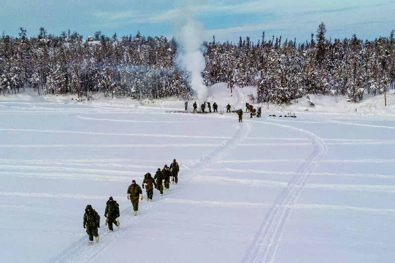 FILE PHOTO: A drone view shows members of 41 Canadian Brigade Group, as part of Task Force Grizzly, carrying their gear back to their arctic tents as Canadian Armed Forces deploy to "Operation Nanook-Nunalivut," an annual series of drills designed to highlight the military's ability to defend the Canadian Arctic, in Yellowknife, Northwest Territories, Canada February 15, 2026. REUTERS/Carlos Osorio/File Photo