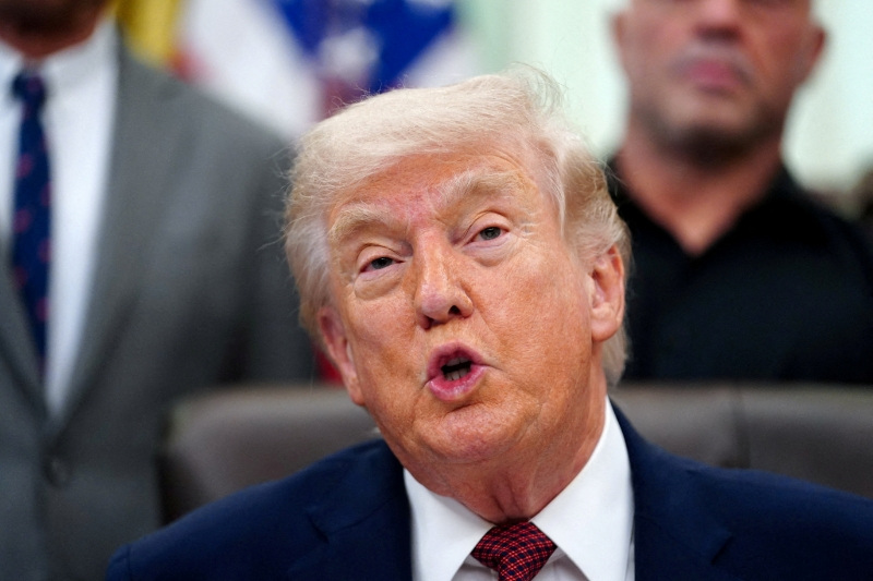 FILE PHOTO: U.S. President Donald Trump speaks about research into mental health treatments in the Oval Office of the White House in Washington, D.C., April 18, 2026. REUTERS/Nathan Howard/File Photo
