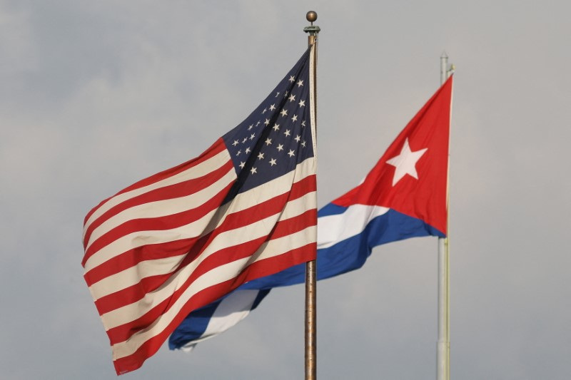 A view of Cuban and U.S. flags beside the U.S. Embassy in Havana, Cuba, May 13, 2024. REUTERS/Alexandre Meneghini