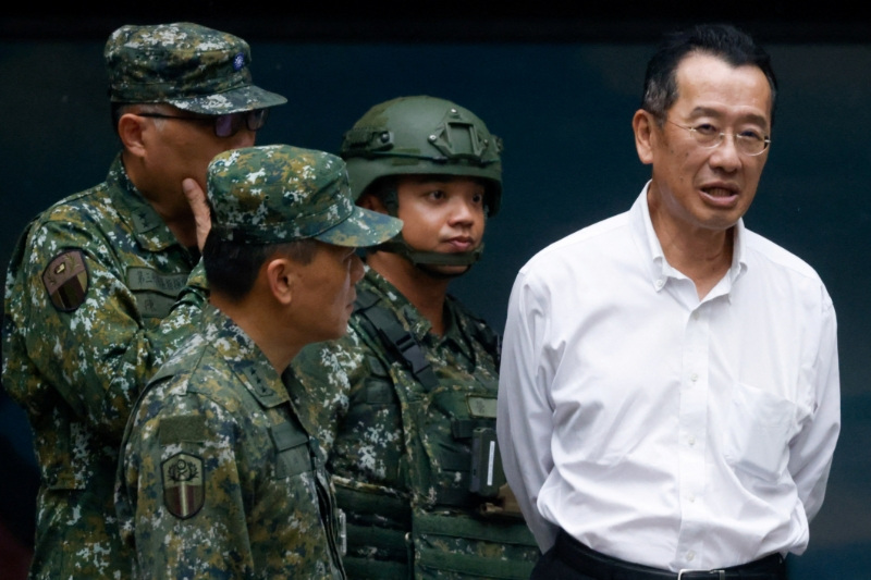 Taiwan's Defence Minister Wellington Koo reacts after visiting a reservists training during annual Han Kuang drill, in New Taipei City, Taiwan July 9, 2025. REUTERS/Ann Wang