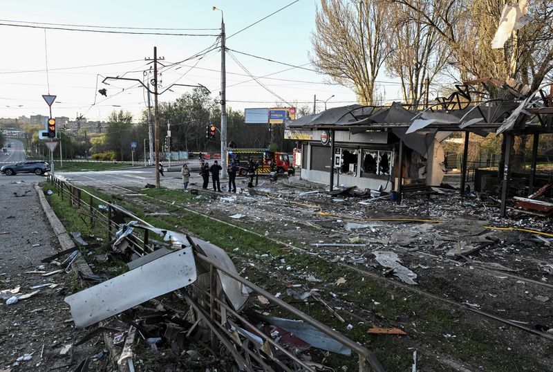 Firefighters work at the site of a Russian combined military strike, amid Russia's attack on Ukraine, in Zaporizhzhia, Ukraine April 15, 2026. REUTERS/Stringer