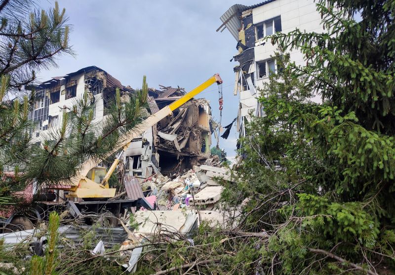 Rescuers work amid debris of a destroyed dormitory building of the Starobilsk College of Luhansk Pedagogical University following an overnight attack, what Russian-installed authorities called a Ukrainian drone strike, in the course of the Russia-Ukraine conflict in the town of Starobilsk (Starobelsk) in the Luhansk region, a Russian-controlled area of Ukraine, May 22, 2026. Picture taken with a mobile phone. REUTERS/Pavel Klimov