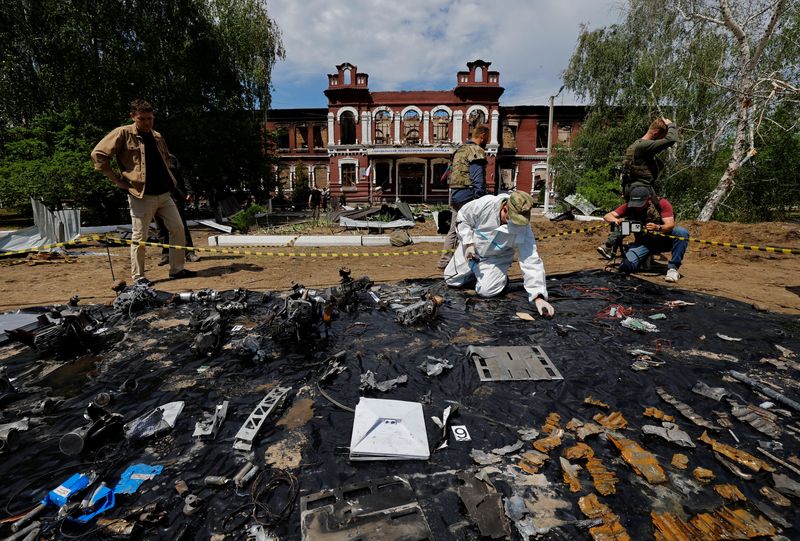 An investigator works in front of the destroyed building of the Starobilsk College of Luhansk Pedagogical University following a recent attack, which Russian authorities called a Ukrainian drone strike, in the course of the Russia-Ukraine conflict in the town of Starobilsk (Starobelsk) in the Luhansk region, a Russian-controlled area of Ukraine, May 24, 2026. Reuters reported from Starobilsk on a media facility trip organised by the Ministry of Foreign Affairs of the Russian Federation on May 24, 2026. REUTERS/Alexander Ermochenko