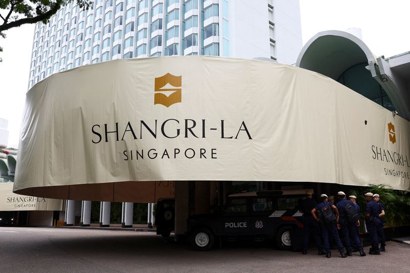 Police stand guard outside the venue of IISS Shangri-La Dialogue security summit in Singapore, May 30, 2025. REUTERS/Edgar Su