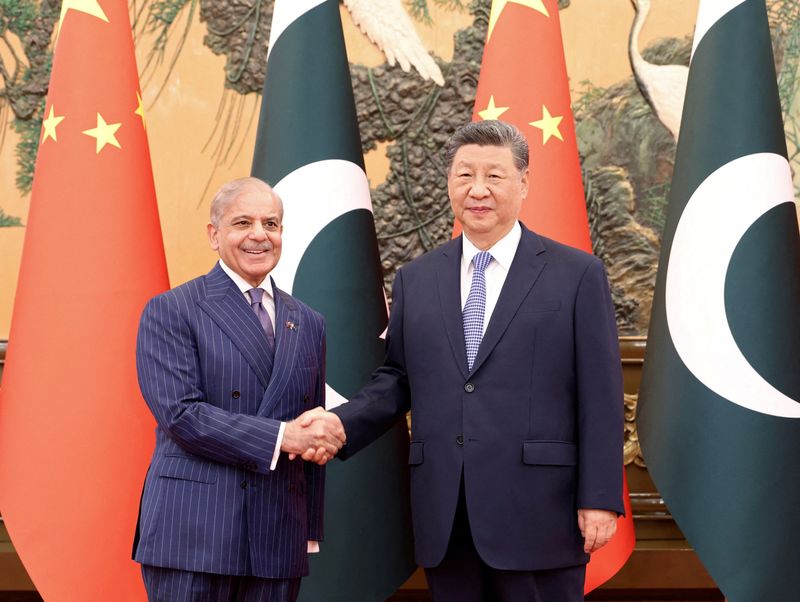 Chinese President Xi Jinping and Pakistani Prime Minister Shehbaz Sharif shake hands at the Great Hall of the People in Beijing, China May 25, 2026.  China Daily via REUTERS