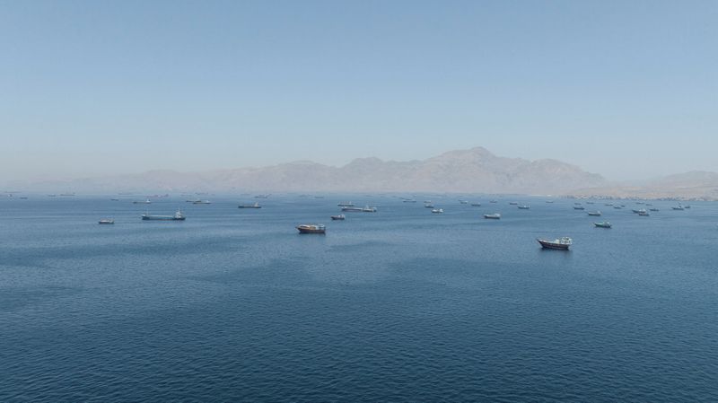 A drone view shows vessels sailing through the Strait of Hormuz, as seen from Musandam, Oman, May 25, 2026. REUTERS/Stringer